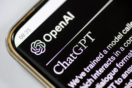 A closeup of a phone screen showing a ChatGPT interface