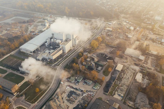 white smoke coming out from building. Photo by Marcin Jozwiak on Unsplash.