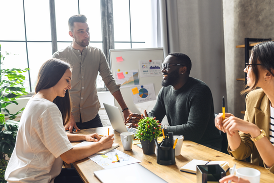 Team of workers at a startup company in an office