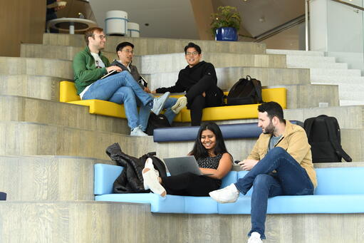 Students chatting casually in Samberg Commons